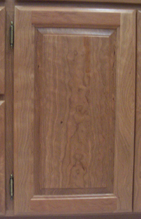 Figured cherry raised panel door